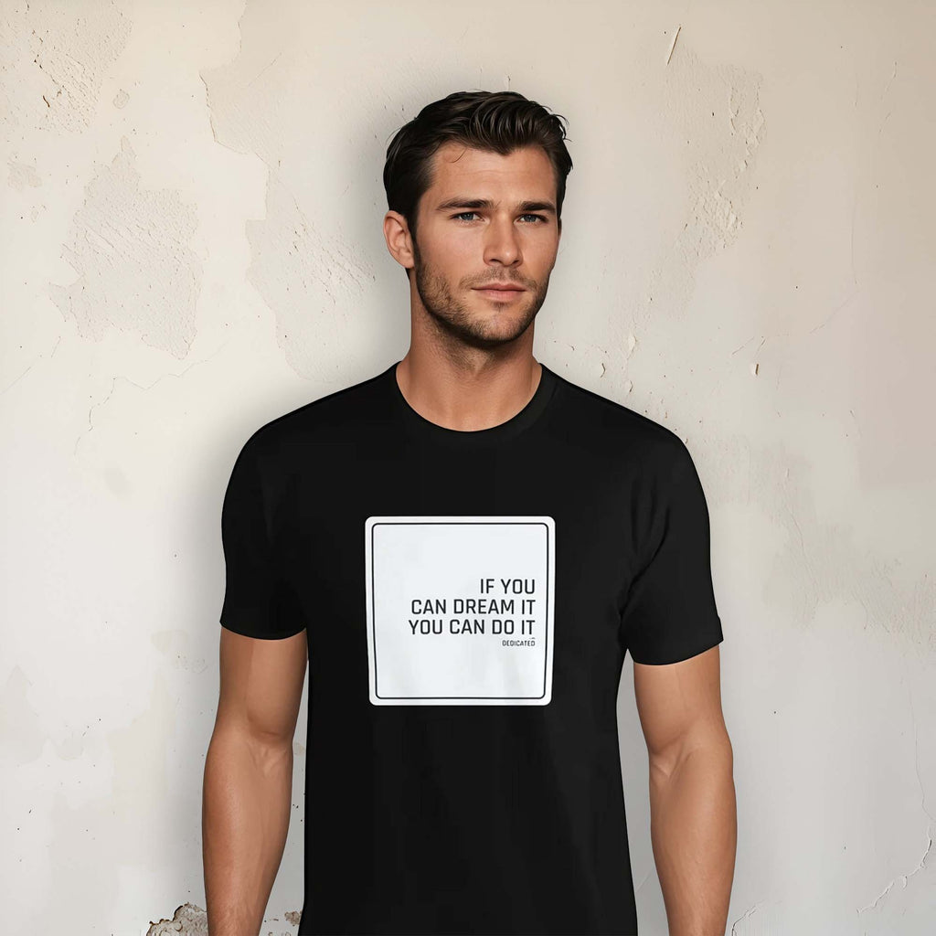 Men's black t-shirt featuring the motivational quote "If you can dream it you can do it" on a neutral background.